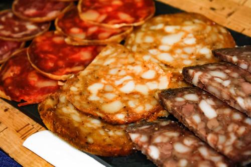 a bunch of different types of food on a table at Hotel Universal Murcia in Murcia