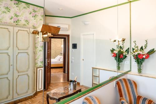 a kitchen with a sink, a cabinet, and a window at Hotel Continental in Treviso
