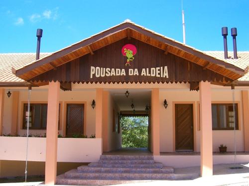 a pucka da alba building with stairs in front at Hotel Fazenda Itáytyba in Tibagi