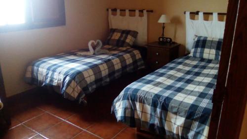 バルベルデにあるcasa La Perdizのベッド2台付きの部屋