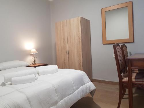 Posteľ alebo postele v izbe v ubytovaní Apartamento Centro de Granada