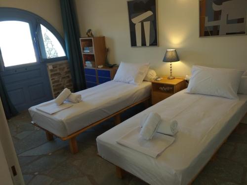 Ένα ή περισσότερα κρεβάτια σε δωμάτιο στο Despotiko View