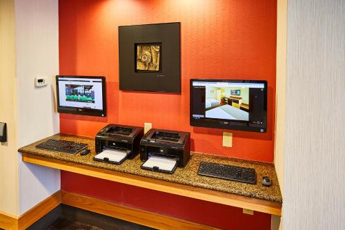 a room with two computers on a counter at LivINN Hotel Cincinnati North/ Sharonville in Sharonville