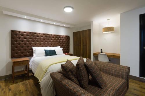 Кровать или кровати в номере Dolce Lobo Boutique Stay