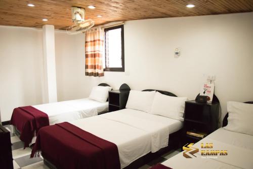 Postel nebo postele na pokoji v ubytování Hotel Las Rampas