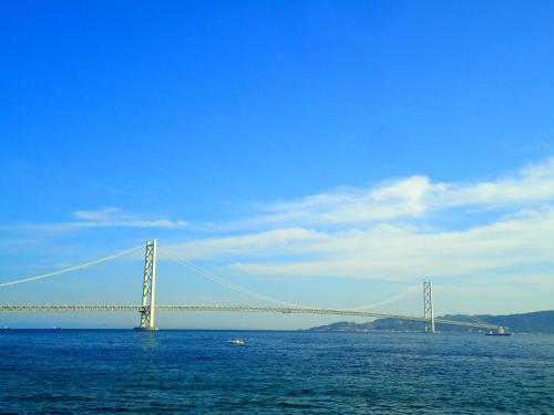 a large bridge in the middle of the water at Hotel Wing International Kobe - Shinnagata Ekimae in Kobe