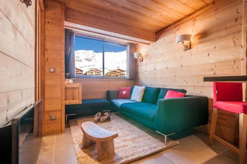 Val Thorens-Cosy Appartement avec vue Vanoise 566にあるシーティングエリア