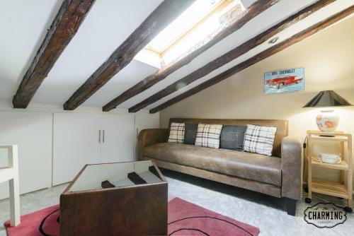 a living room with a couch and a table at Charming Fuencarral Street in Madrid