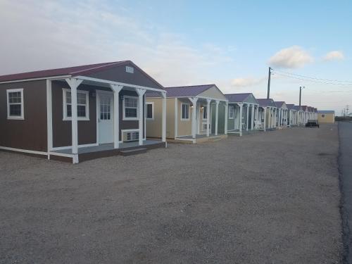 a row of houses parked in a lot at Stateline Cabin in Hobbs