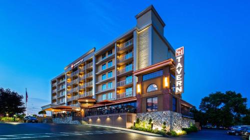 a rendering of a hotel building at night at Best Western Plus Waltham Boston in Waltham