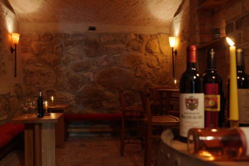 a room with some bottles of wine on a table at Hotel Gutshaus Parin - Bio- und Gesundheitshotel in Parin