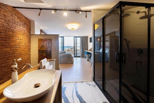 a bathroom with a shower, sink, and toilet at Sublime Porte Hotel in Istanbul
