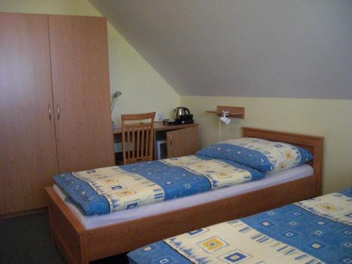 Ένα ή περισσότερα κρεβάτια σε δωμάτιο στο Pension Olga