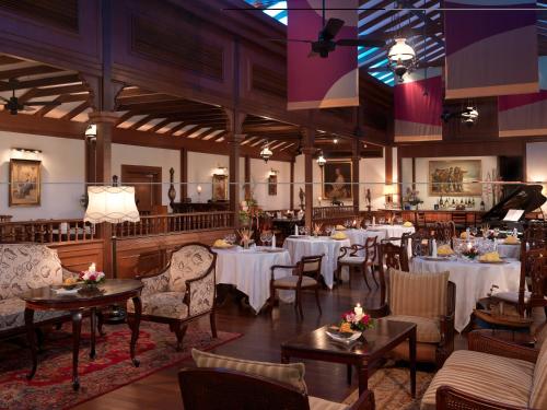 a restaurant with tables and chairs in a room at Concorde Hotel Kuala Lumpur in Kuala Lumpur