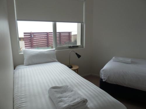 Ένα ή περισσότερα κρεβάτια σε δωμάτιο στο Bridport Horizon Views