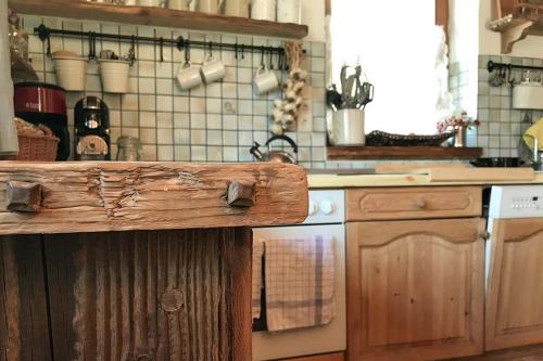 a kitchen with a wooden counter top and a stove at Rauriser Bergchalet in Rauris