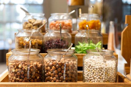 a group of jars filled with nuts and seeds at Novotel Trabzon in Trabzon