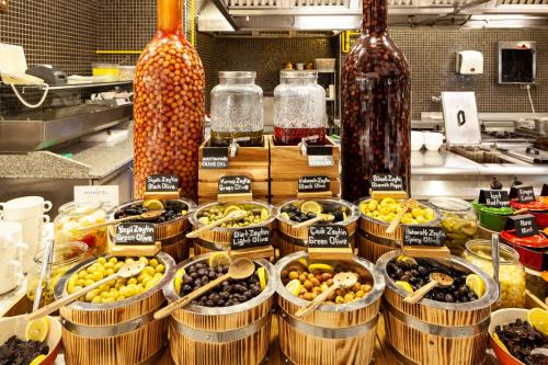 a bunch of baskets filled with different types of fruit at Novotel Trabzon in Trabzon