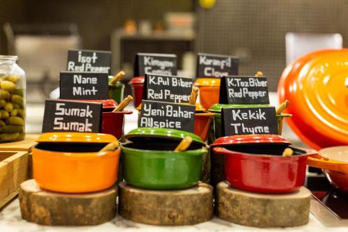 a display of different colored bowls on a table at Novotel Trabzon in Trabzon