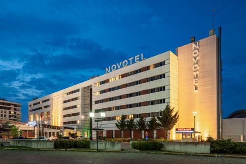 a hotel building with a sign on top of it at Novotel Trabzon in Trabzon