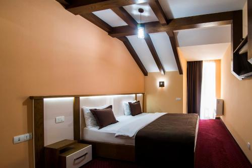 a bedroom with a large bed in a room at Elegant Hotel & Resort in Tsaghkadzor