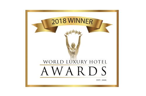 a poster for the world luxury hotel awards with a trophy at NAU Palacio do Governador in Lisbon