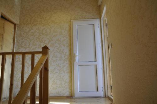 an empty hallway with a door in a room at Fairy Tale in Gabala