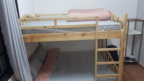 a couple of bunk beds in a room at Forelsket 2 in Da Lat