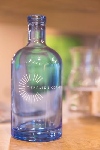 a glass bottle sitting on top of a table at ibis Zürich Messe Airport in Zürich