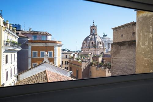 a view of the roofs of buildings from a window at Rent in Rome - IV Novembre in Rome