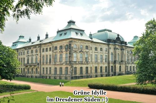 a large building with people walking in front of it at Haus Grüne Idylle in Bannewitz