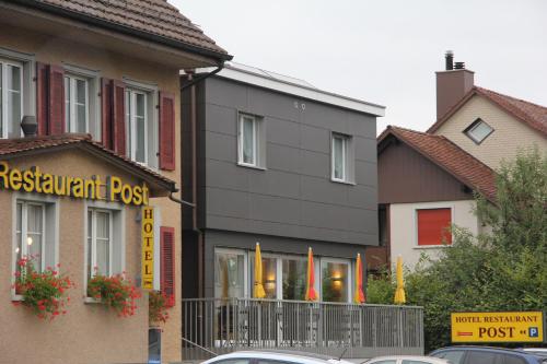 a restaurant post sign in front of a building at Hotel / Restaurant Post in Eschlikon