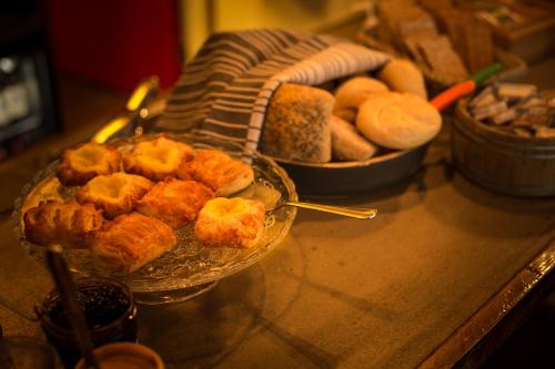 a counter top with a bunch of food on a table at Akureyri Backpackers in Akureyri