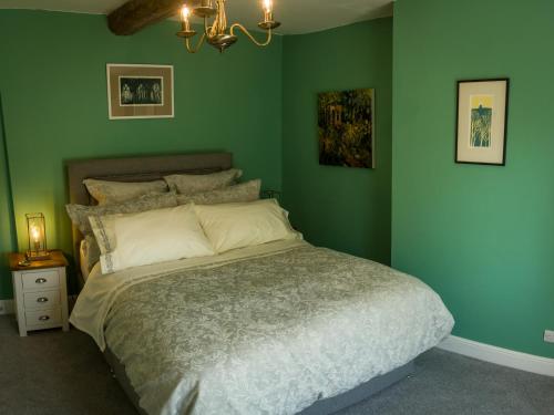 Кровать или кровати в номере Garden House