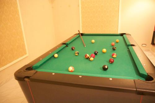 a pool table with balls on top of it at Hotel Nuovo Rebecchino in Naples