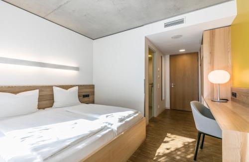 Katil atau katil-katil dalam bilik di Green City Hotel Vauban