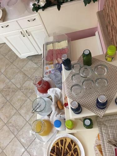a kitchen counter with a table with dishes on it at Palazzo Reginella in Bovalino Marina