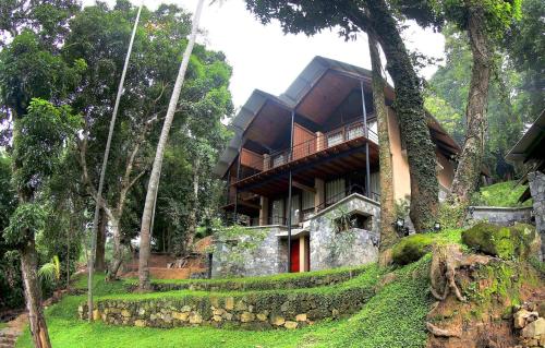 a house in the middle of a forest at SWP Eco Lodge in Kandy