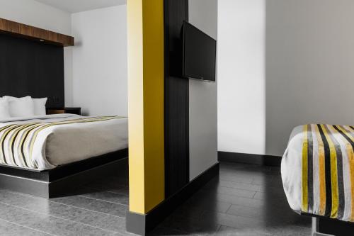 Postel nebo postele na pokoji v ubytování Hotel Le Littoral