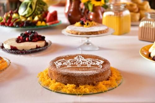 a table topped with cakes on top of a table at Pousada Convento de Vila Viçosa in Vila Viçosa