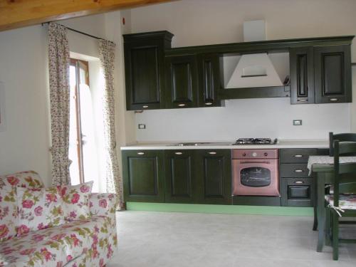 Kuchyň nebo kuchyňský kout v ubytování Residence La Pineta
