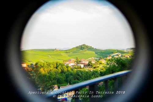 a view from a window of a village in the hills at Il Borgo B&B in Castellinaldo