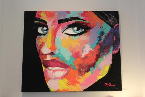 a painting of a woman on a wall at Galerie Hotel Dis in Maastricht