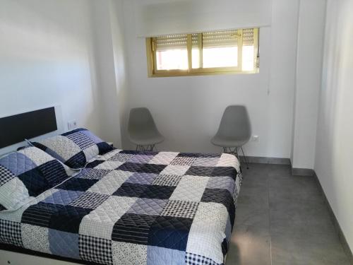 Postel nebo postele na pokoji v ubytování PRECIOSO APARTAMENTO EN PRIMERA LINEA DE MAR