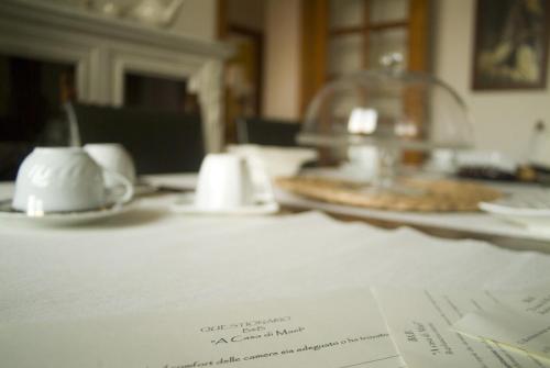 a table with a plate of food on top of a table at B&B A Casa di Mael in San Costanzo