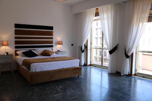 Ένα ή περισσότερα κρεβάτια σε δωμάτιο στο Neapolis City Life