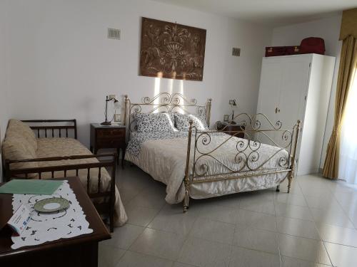 Postel nebo postele na pokoji v ubytování Gianmaria B&B