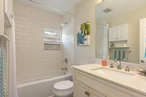a bathroom with a sink and a toilet and a bath tub at Ultimate Beach Bungalow - 1 block from beach - huge backyard in Carlsbad