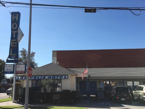 a pole with a stop sign in front of a motel at Los Feliz Hotel in Glendale