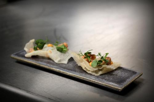 two tacos on a plate on a table at Hotel The Royal Snail in Namur